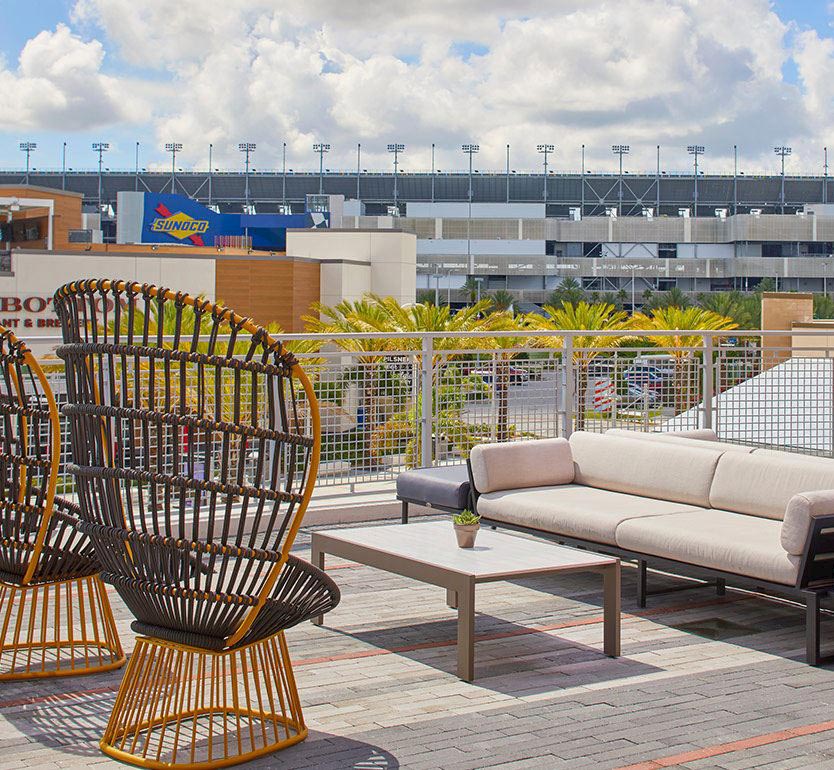 How far is The Daytona Hotel from Daytona International Speedway?